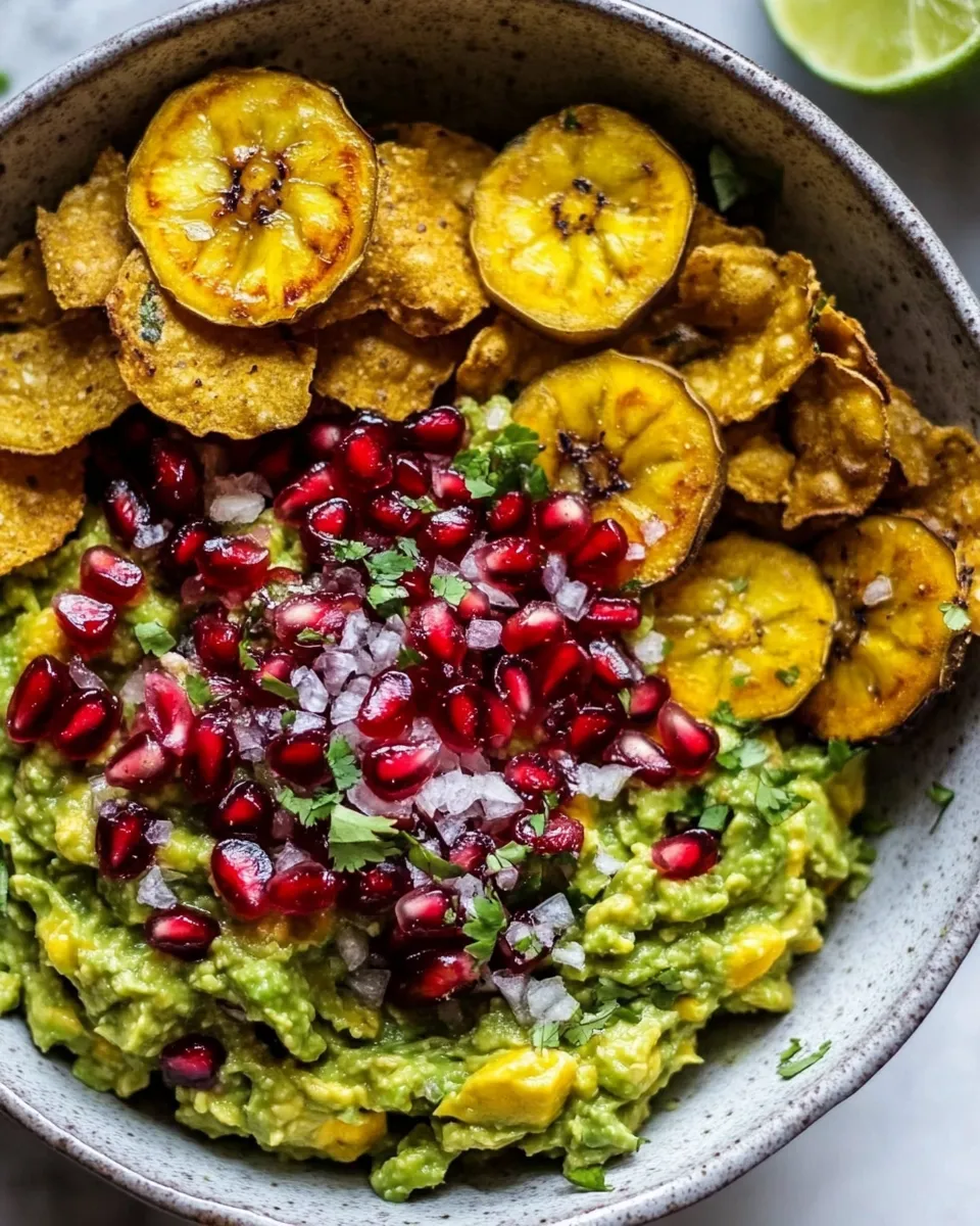 Fresh Pomegranate Guacamole with Fried Plantain Chips. food shot