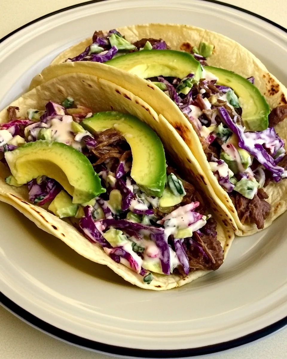 Classic Shredded Beef Tacos with Spicy Slaw and Avocado image