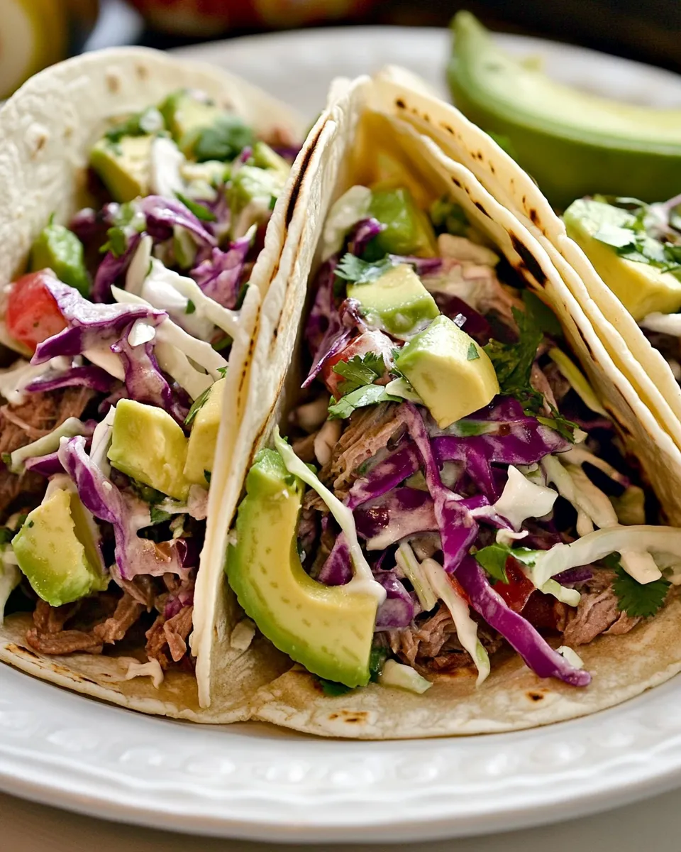 Delicious Shredded Beef Tacos with Spicy Slaw and Avocado shot