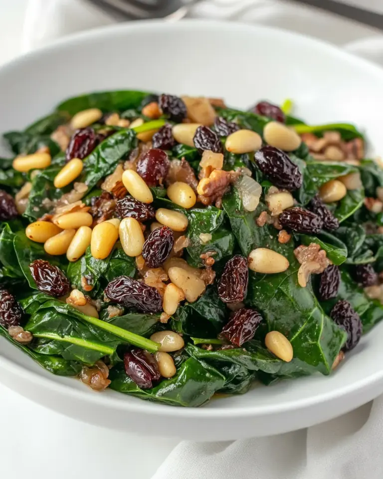 Homemade Spinach with Olives Raisins and Pine Nuts photo